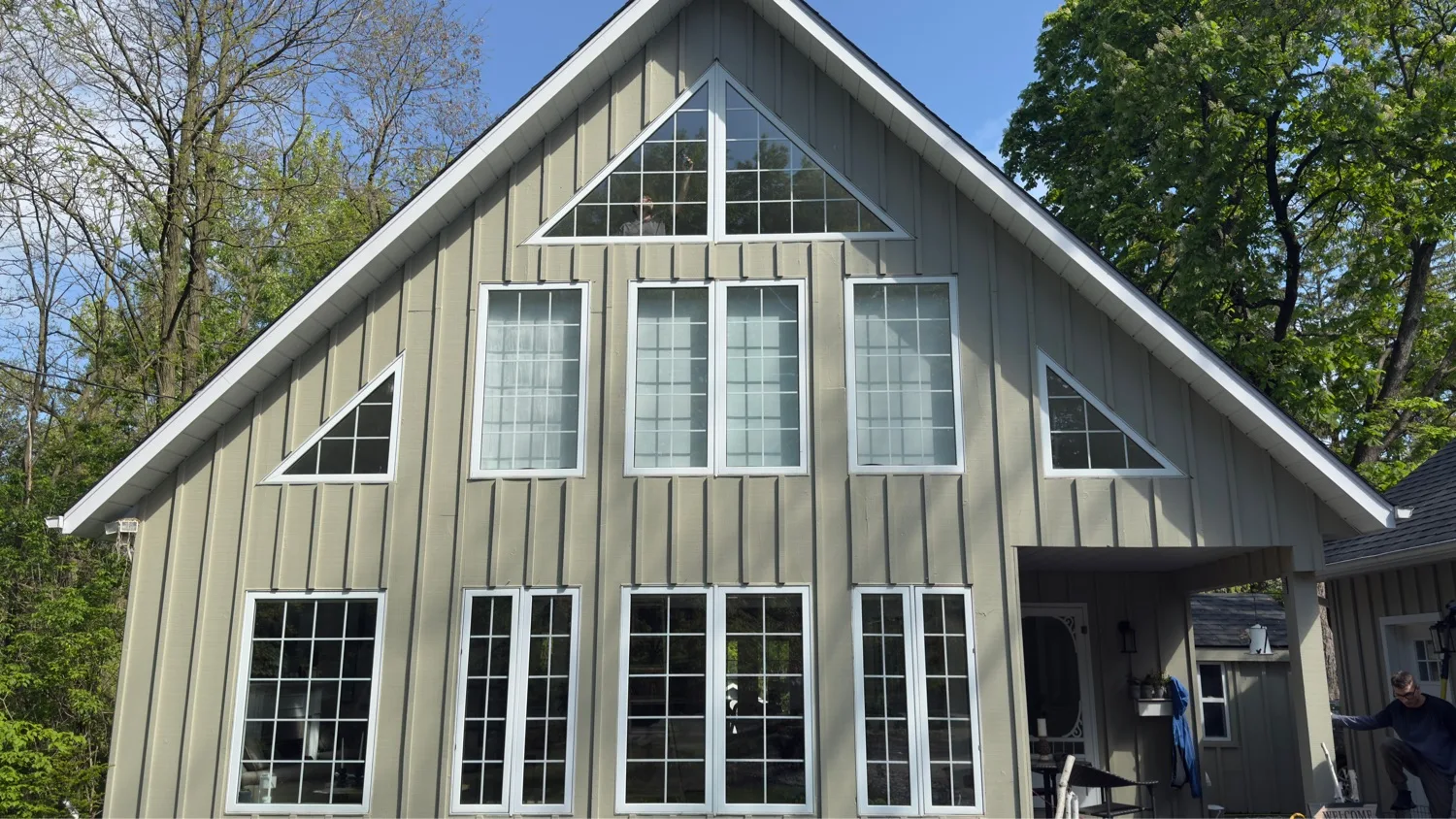 Custom window installation on A-frame gable home with triangular gable windows — D&D Exterior Finishing Kitchener-Waterloo